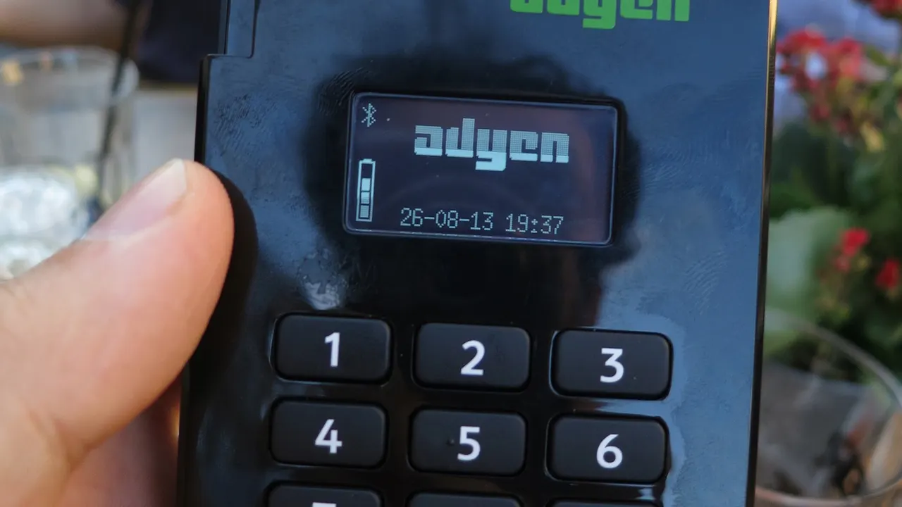 A card payment terminal on a counter